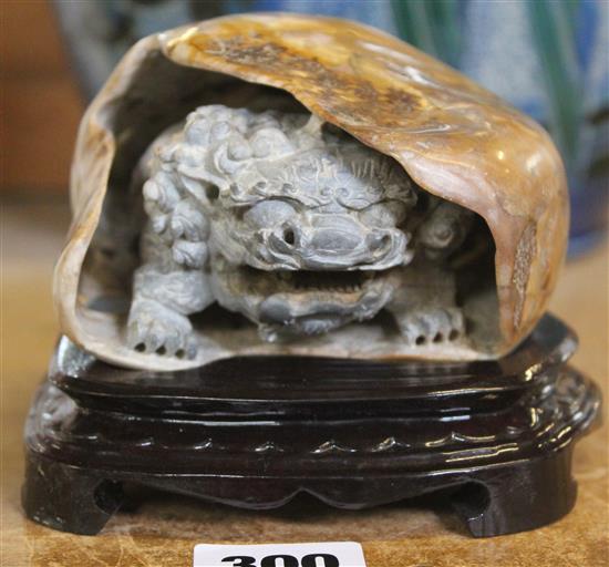 Chinese lion-dog boulder carving wood stand